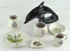 A selection of Poole pottery, including a large dolphin,