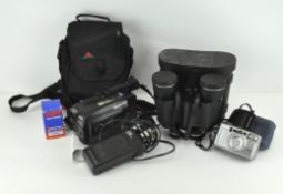 A cased pair of Pathescope 16 x 50 binoculars, a JVC Camcorder, and a samsung compact camera.