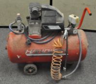 A handy air compressor with petrol combustion engine
