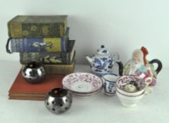 A collection of ceramics and books