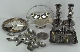 A collection of silver plated wares, including candlesticks, swing handled fruit basket,