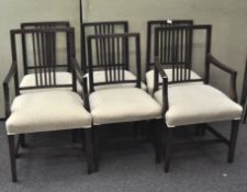 A set of six stained oak dining chairs, including two carver chairs,