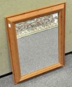 A modern pine wall mirror of rectangular form,