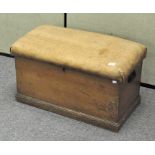 A vintage pine blanket box, with hessien upholstered top,