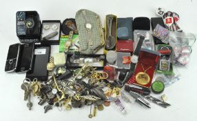 An eclectic collection of items, to include costume jewellery, mobile phones, darts,