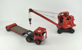 A vintage metal toy crane on matching transport lorry. Lorry length 38cm.