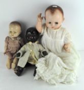 A group of three vintage dolls including one by Pedigree
