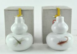 Two Chinese vases, of double gourd form, decorated a carp and a dragonfly, H 11.5cm in fitted cases.