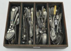 A collection of silver plated flatware including knife rests, forks,