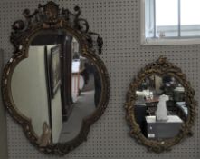 Two ornate gilt framed wall mirrors,