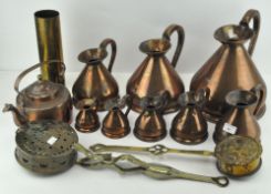 A graduated set of 8 copper haystack measures and other metalware