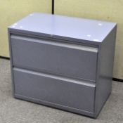 A blue two draw filing cabinet,