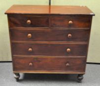 A Victorian mahogany chest of drawers, raised on turned supports, two short over three long drawers,
