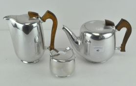 A Piquot ware Newmaid part tea set comprising teapot, hot water jug and sugar basin,