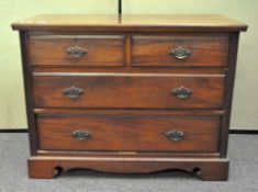 An Edwardian walnut chest of drawers, two short over three long drawers,