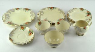 A Royal Cauldron Art Deco part tea service, decorated with tall trees and floral motifs,