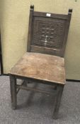 An oak carved chair, early 20th century, with carved square back,