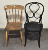 Two small chairs, one being black painted,