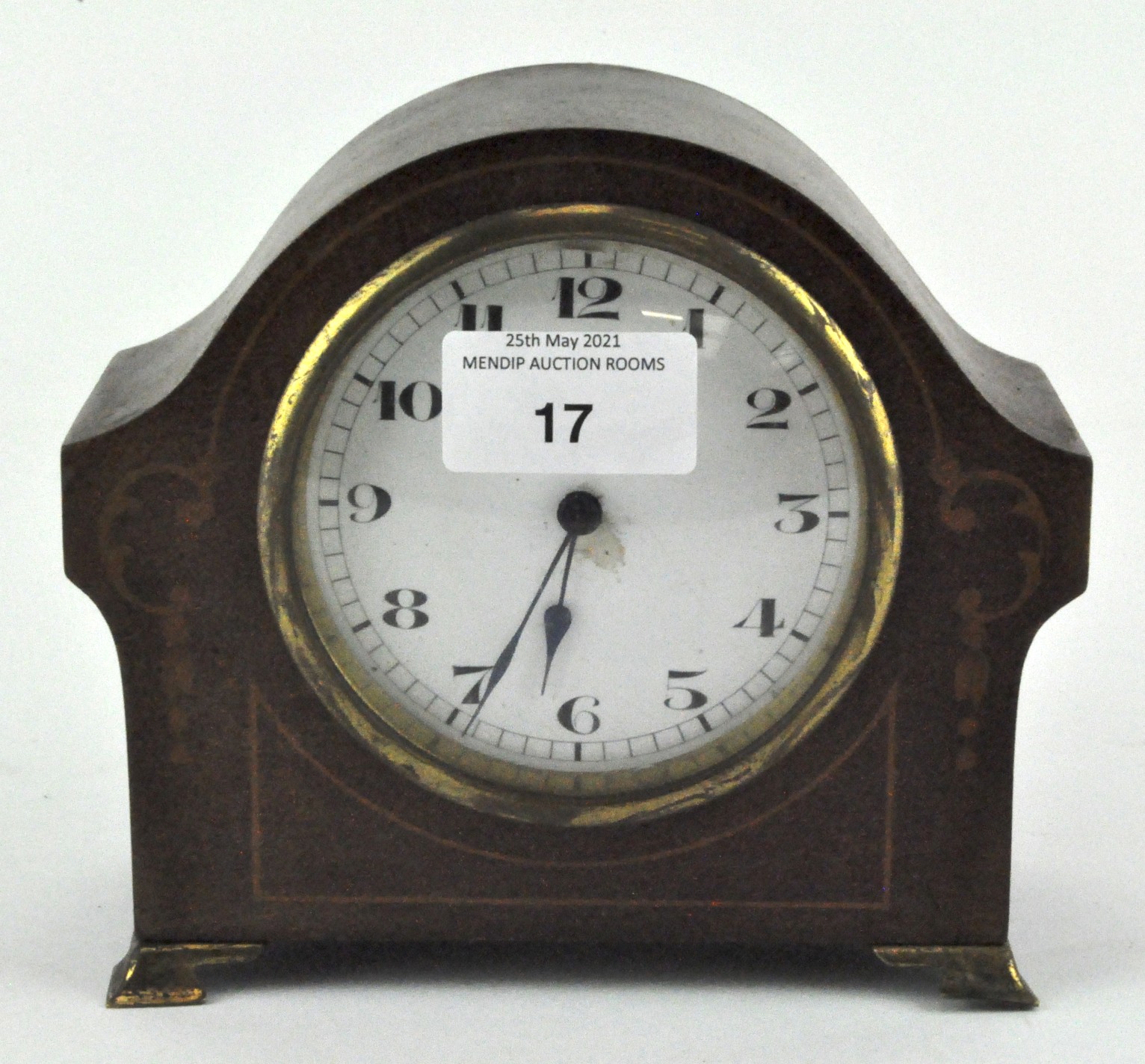 An Edwardian mantel clock, the enamel dial with Arabic numerals,
