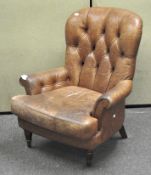 A leather button back armchair,