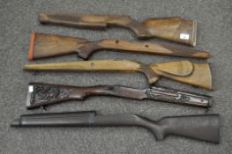 A group of five shotgun/rifle butts including heavy carved example