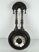 A late 19th/early 20th century aneroid barometer and thermometer,