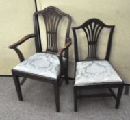 Two Victorian mahogany dining chairs, one being a carver,