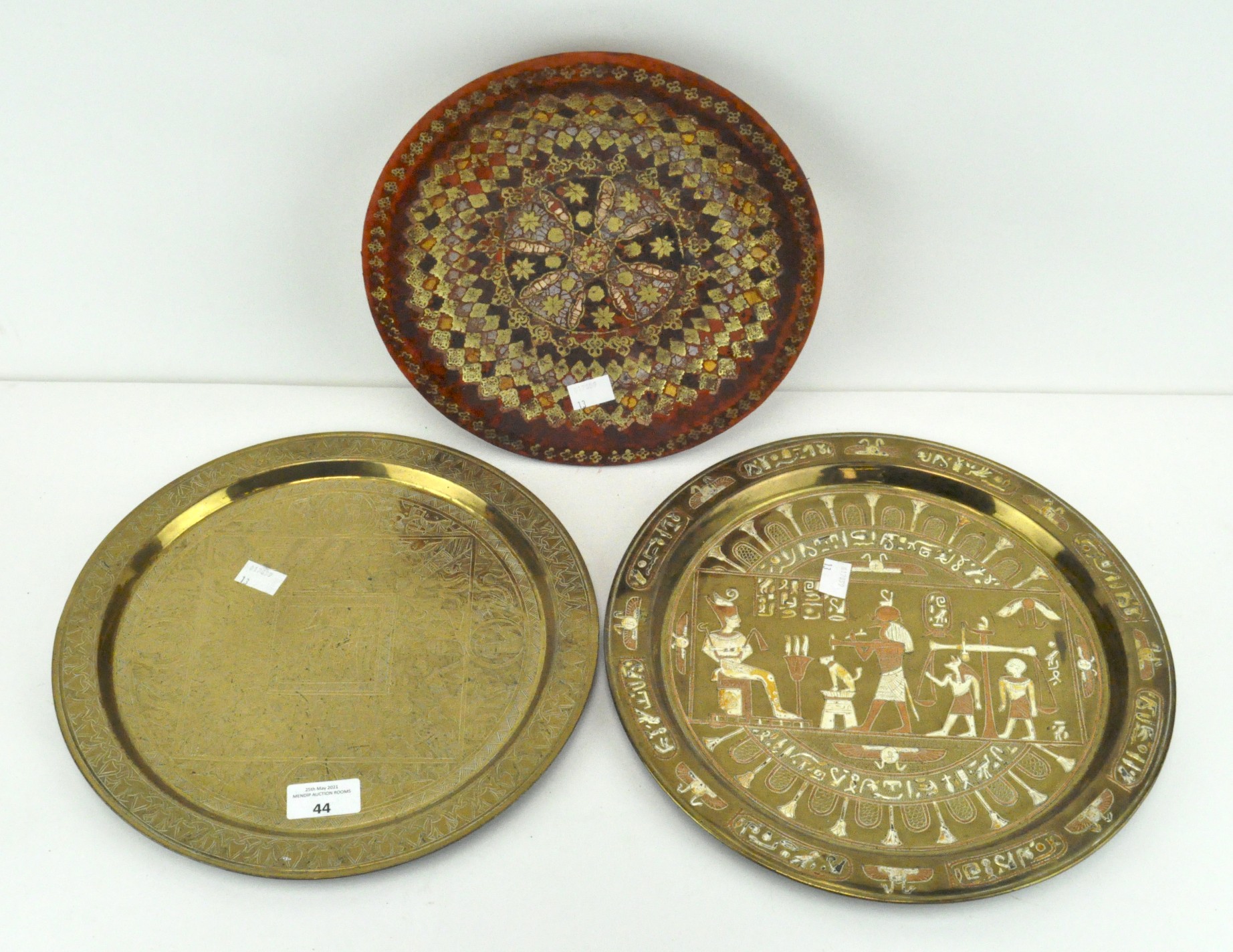 An Egyptian inlaid brass charger decorated with Hieroglyphics,