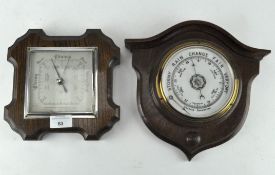 An Edwardian barometer on oak shield shape plinth, H 26cm,