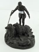 A resin figure group, depicting a shepherd with two sheep and sheep dog, signed G Tiney. H 28cm.