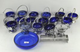 A group of blue glass and chrome plated dishes,