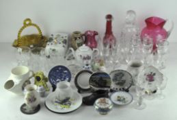 A collection of assorted ceramics and other items including cranberry glass, wine glasses,