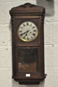 An early 20th century mahogany cased wall clock,