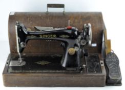 A 20th century Singer sewing machine with pedal, no Y7949249,