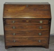 A Victorian mahogany bureau, the drop front opening to reveal fitted interior,