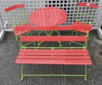 A Child's metal garden furniture comprising a bench,