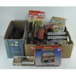 A collection of model railway related items, including buildings, scenery,