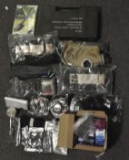 A survival kit, gun case and other items