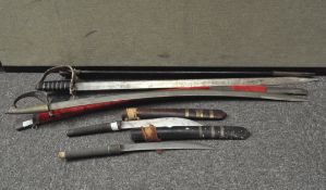 Two large Indian swords with scabbards, together with two similar knives,