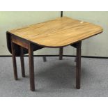 A late 19th century mahogany drop leaf dining table,