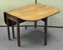 A late 19th century mahogany drop leaf dining table,