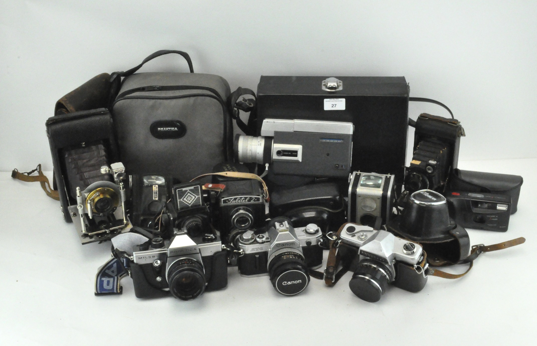 A Canon AT-! slr camera, a Lubitel 2 twin lens reflex example, 2 folding cameras and related items