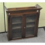 A mahogany display cabinet top section,