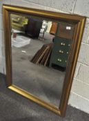 A large modern gilt framed bevelled wall mirror, with beeded border,