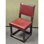 A heavy oak upholstered chair, with turned supports,