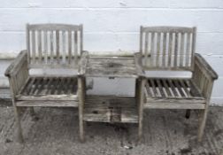 A wooden two seater and table garden set,