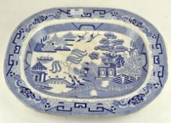 A blue and white Willow Pattern meat plate,