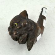A heavily carved pipe in the form of a dog,