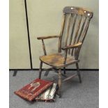 A traditional lathe back kitchen chair, on turned supports,