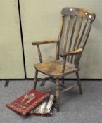 A traditional lathe back kitchen chair, on turned supports,